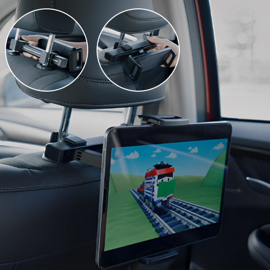 Deux enfants regardant un film avec un support tablette voiture installé entre les siÚges avant.